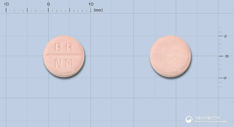 네오메디코푸정 앞뒤 사진 (분홍색 원형, 각인 BR NM)
