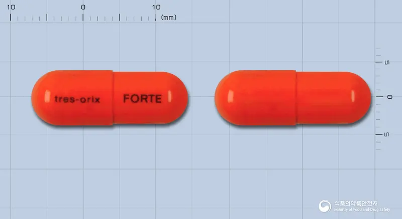 신일트레스오릭스훠트캡슐 앞뒤 사진 (주황색 캡슐, 각인 tres-orix FORTE)