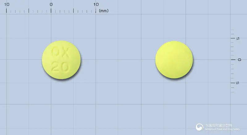 옥사페란정20mg(요오드화옥사피움) 앞뒤 사진 (노란색 원형, 각인 OX20)