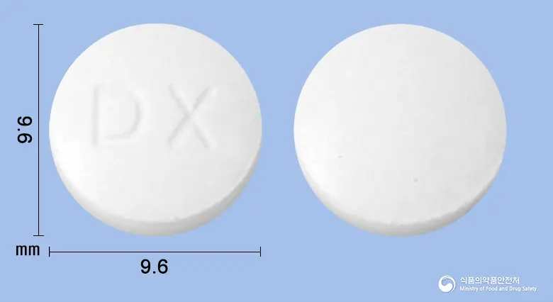 리락신정(카르바민산클로르페네신)(수출용)(수출명:DONGKOO RILAXINE Tablets) 앞뒤 사진 (흰색 원형, 각인 DX)