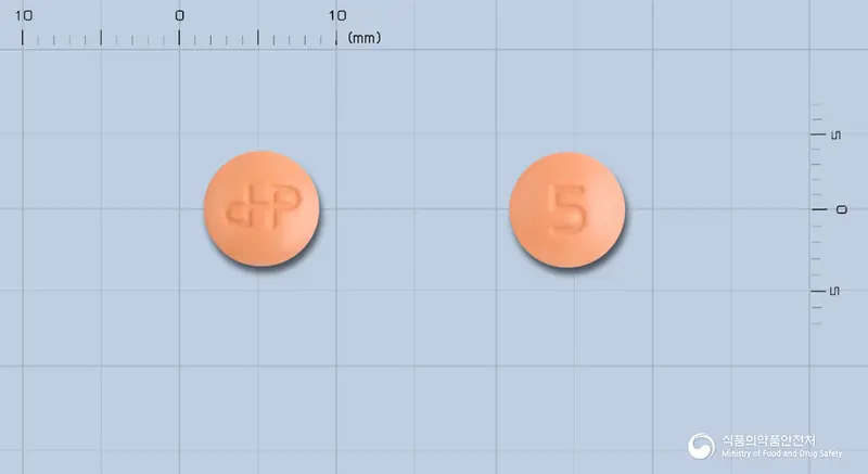 가르젠정<세라티오펩티다제> 앞뒤 사진 (주황색 원형, 각인 5)