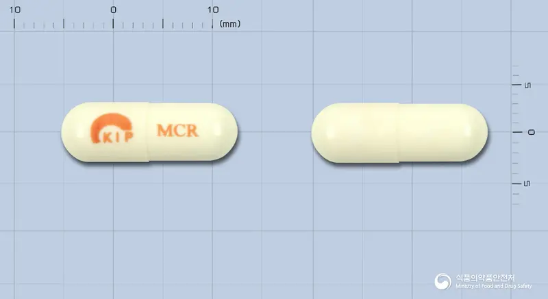 무코릴캡슐(치오콜치코시드) 앞뒤 사진 (흰색 캡슐, 각인 MCR)