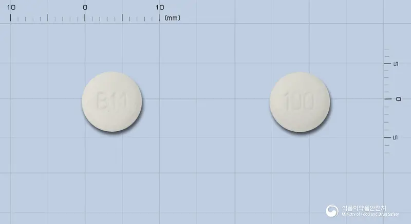 비마르크정100밀리그램(에녹사신수화물) 앞뒤 사진 (흰색 원형, 각인 BM / 100)
