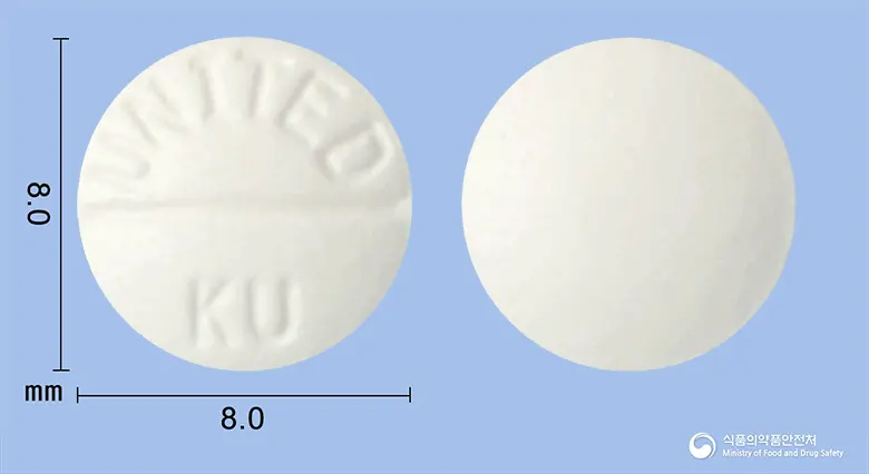 타목센정10밀리그램(타목시펜시트르산염)(수출용)(수출명:Tamooex Tabs.10mg,XifenTabs.10mg,GyraxenTabs.10mg) 앞뒤 사진 (흰색 원형, 각인 UNITED KU)