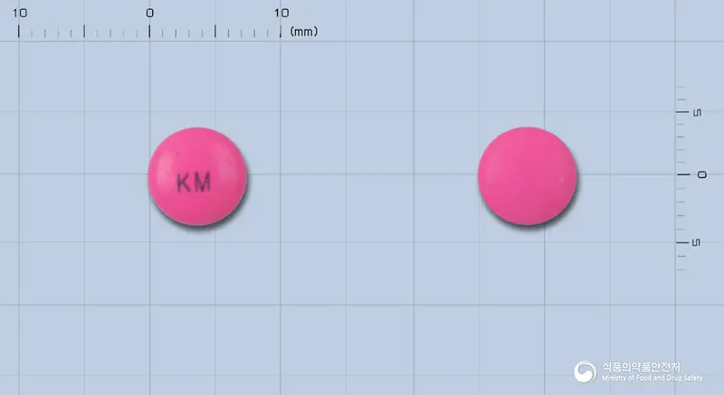 파니드정(인다파미드)(수출용) 앞뒤 사진 (분홍색 원형, 각인 KM)