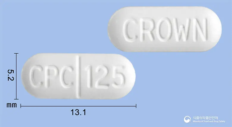 르네신정(클로르페네신카르바메이트) 앞뒤 사진 (흰색 장방형, 각인 CPC 125 / CROWN)