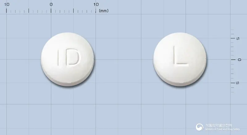 엘칸정330밀리그램(L-카르니틴) 앞뒤 사진 (흰색 원형, 각인 ID / L)