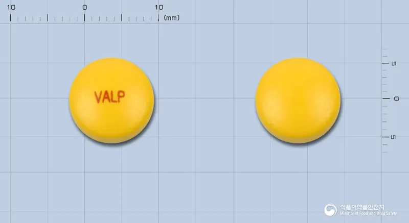 발폰정(발프로산나트륨) 앞뒤 사진 (노란색 원형, 각인 VALP)