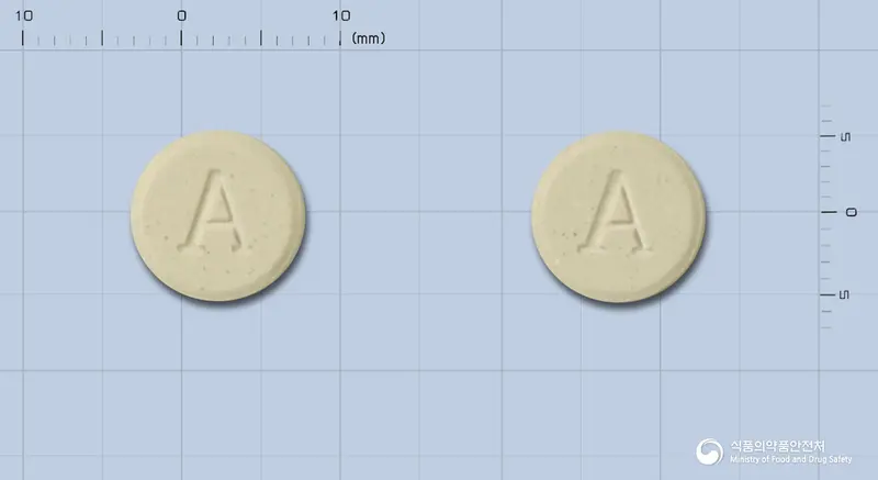 알사반정(수출명:크래패트정) 앞뒤 사진 (회색 원형, 각인 A / A)