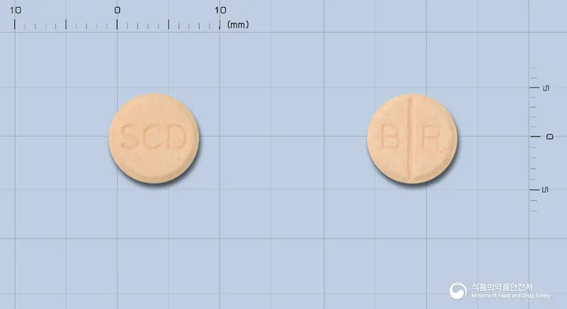 바로타제정 앞뒤 사진 (분홍색 원형, 각인 SCD / B R)