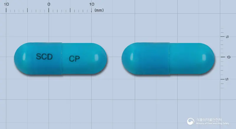 삼천당세프라딘캡슐(세프라딘수화물)(수출명:삼천당세프라딘캡슐500mg) 앞뒤 사진 (파란색 캡슐, 각인 SCD CP)