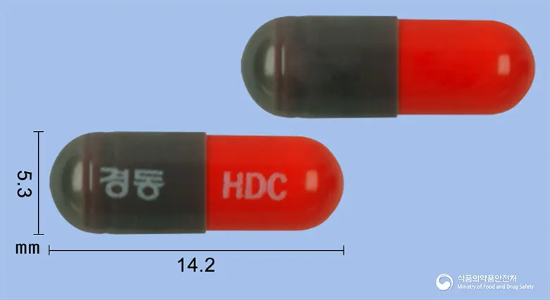 헤다크캡슐(플루나리진염산염) 앞뒤 사진 (회색 캡슐, 각인 경동 HDC)