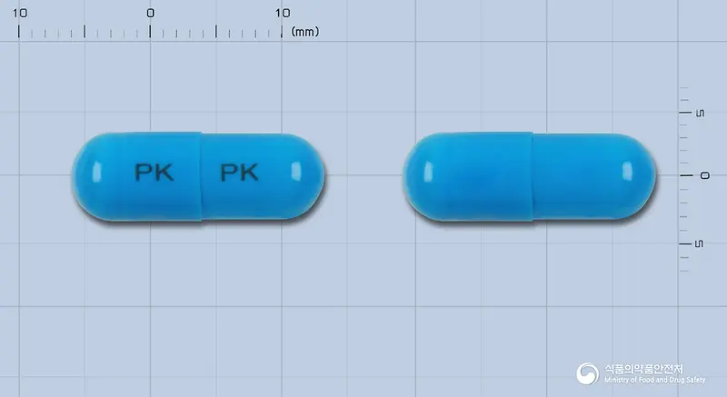 카바롤캅셀 앞뒤 사진 (파란색 캡슐, 각인 PK PK)