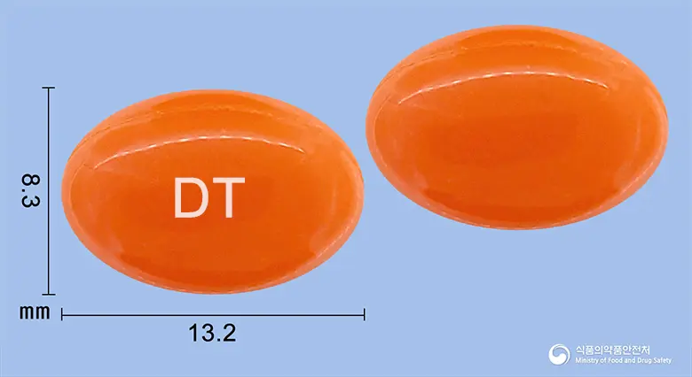 덴타돌연질캡슐(옥수수불검화정량추출물) 앞뒤 사진 (주황색 캡슐, 각인 DT)