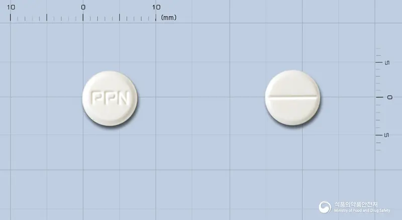 포피란정(염산피폭솔란) 앞뒤 사진 (흰색 원형, 각인 PPN)