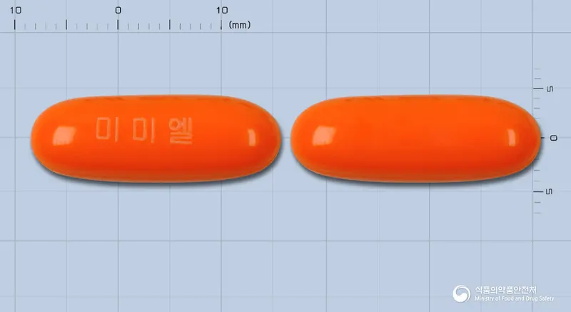 미미엘연질캡슐(엘시스틴)(수출용) 앞뒤 사진 (주황색 캡슐, 각인 미미엘)
