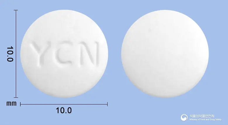코라신정(클로닉신리시네이트) 앞뒤 사진 (흰색 원형, 각인 YCN)