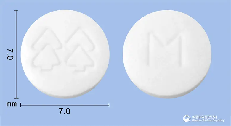 미드론정(미도드린염산염) 앞뒤 사진 (흰색 원형, 각인 M)