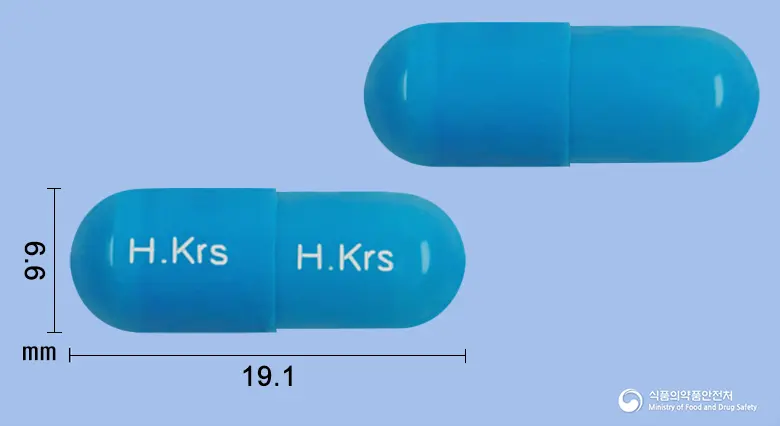 코러스에토돌락캡슐(수출명 : KORULAC Cap.)(수출용) 앞뒤 사진 (파란색 캡슐, 각인 H.Krs H.Krs)