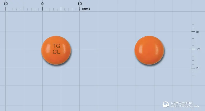 클로마진정50mg(클로르프로마진염산염) 앞뒤 사진 (주황색 원형, 각인 TGCL)