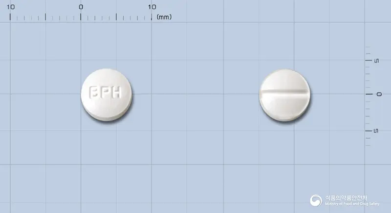 아놀핀정50밀리그람(아테놀올)(수출명:AtemoreTab.50mg) 앞뒤 사진 (흰색 원형, 각인 BPH)