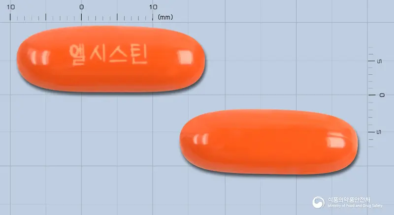 동구엘시스틴연질캡슐 앞뒤 사진 (주황색 캡슐, 각인 엘시스틴)