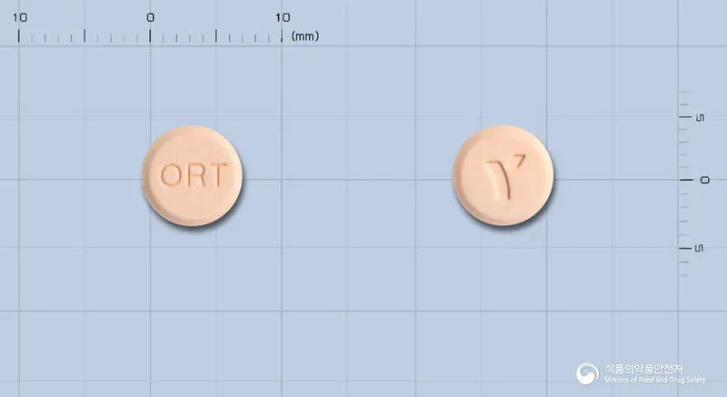 오르다제정(스트렙토키나제·스트렙토도르나제) 앞뒤 사진 (분홍색 원형, 각인 ORT)