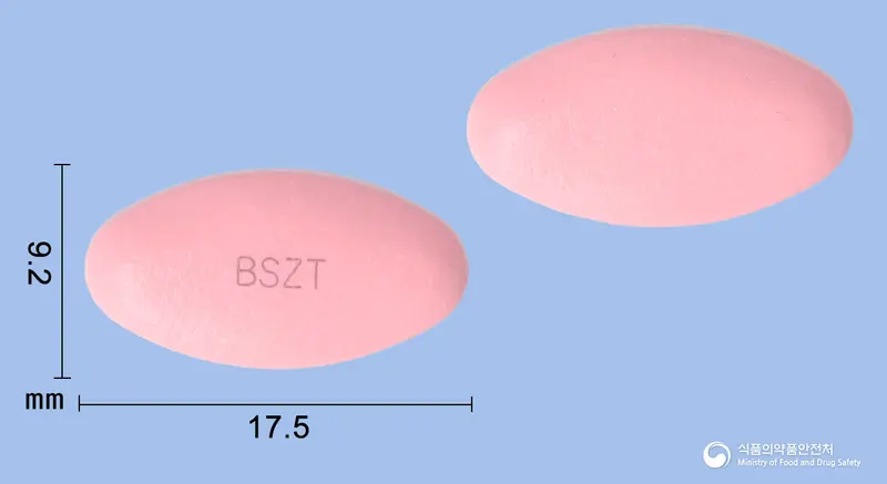 베스자임정 앞뒤 사진 (분홍색 타원형, 각인 BSZT)
