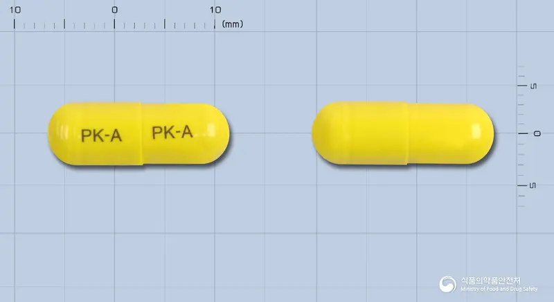 치아튼캅셀 앞뒤 사진 (노란색 캡슐, 각인 PK-A PK-A)