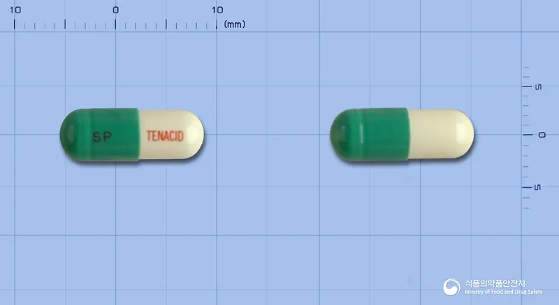 테나시드캡슐(테프레논) 앞뒤 사진 (초록색 캡슐, 각인 SP TENACID)