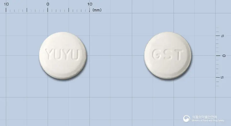 개비콘에스정 앞뒤 사진 (흰색 원형, 각인 YUYU / GST)