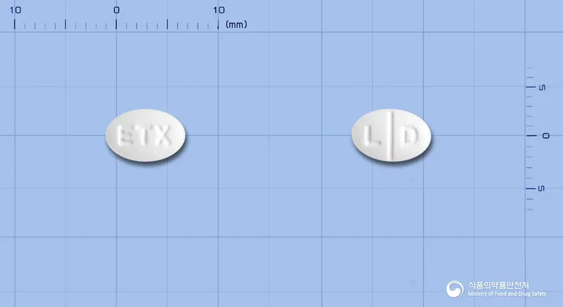 로리딘정(로라타딘) 앞뒤 사진 (흰색 타원형, 각인 ETX / L D)