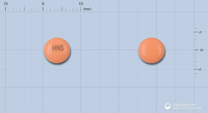 스파리나정(카로베린) 앞뒤 사진 (주황색 원형, 각인 HNS)