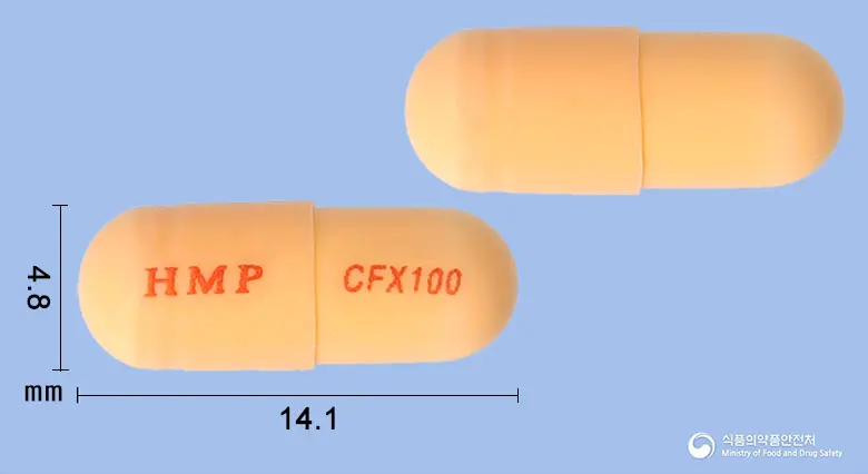 세픽스캡슐100밀리그램(세픽심수화물) 앞뒤 사진 (주황색 캡슐, 각인 HMP CFX100)
