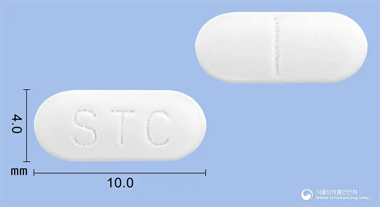 세리텍정(세티리진염산염) 앞뒤 사진 (흰색 장방형, 각인 STC)