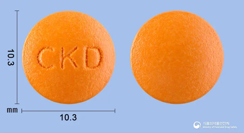 이튼큐정(옥수수불검화정량추출물) 앞뒤 사진 (주황색 원형, 각인 CKD)