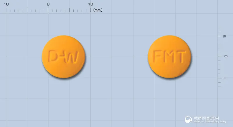 후라모톨정(탈니플루메이트) 앞뒤 사진 (주황색 원형, 각인 D-W / FMT)