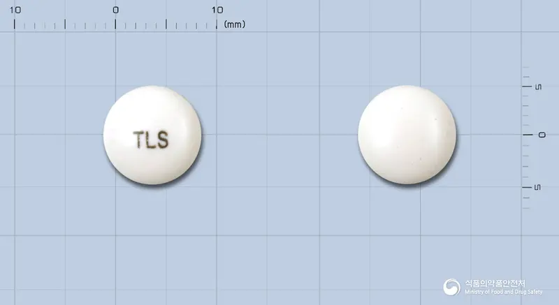 톨리손정(톨페리손염산염)(수출명:제쏘틸정)(수출용) 앞뒤 사진 (흰색 원형, 각인 TLS)