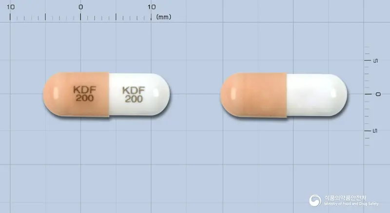 광동독시플루리딘캡슐200밀리그램 앞뒤 사진 (분홍색 캡슐, 각인 KDF KDF200 200)