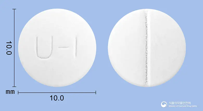 유니탁정 앞뒤 사진 (흰색 원형, 각인 U-I)