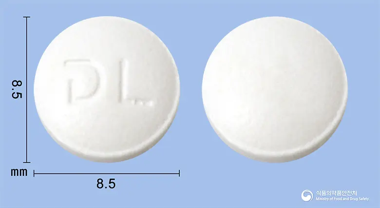 레비신정100mg(레보플록사신) 앞뒤 사진 (흰색 원형, 각인 L)