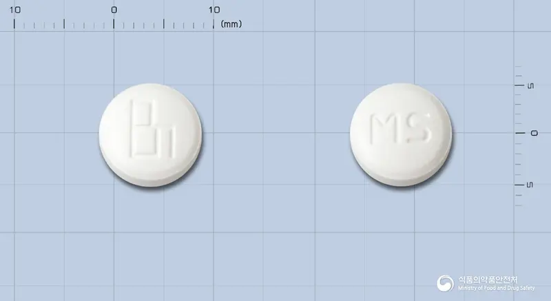 미겔에스정 앞뒤 사진 (흰색 원형, 각인 MS)