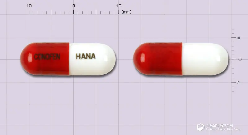코노펜캡슐 앞뒤 사진 (빨간색 캡슐, 각인 CONOFEN HANA)
