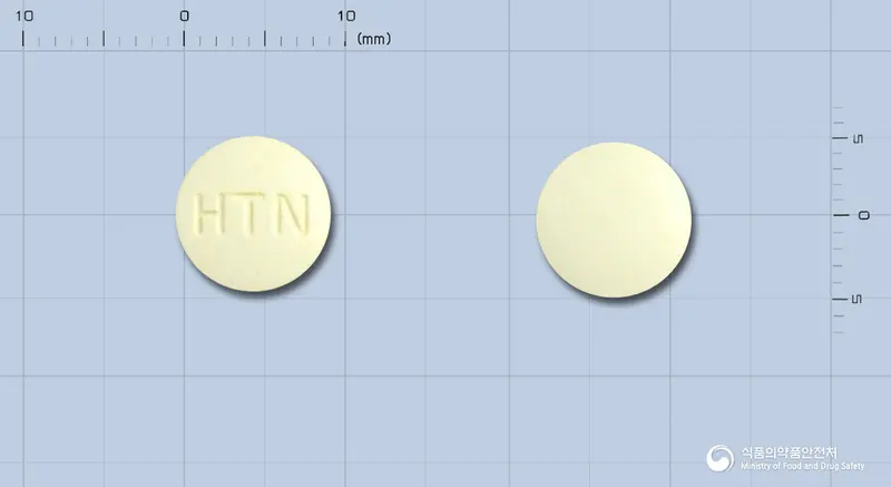 라니신정(수출명:도한(DOHAN)정) 앞뒤 사진 (흰색 원형, 각인 HTN)