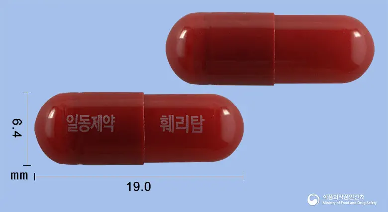 훼리탑캡슐(글루콘산제이철나트륨착염) 앞뒤 사진 (빨간색 캡슐, 각인 일동제약 훼리탑)
