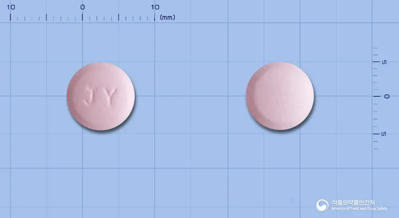 지노플러스정 앞뒤 사진 (분홍색 원형, 각인 JY)