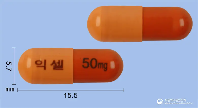 익셀캡슐50밀리그램(밀나시프란염산염) 앞뒤 사진 (주황색 캡슐, 각인 익셀 50mg)