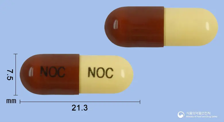 한신노콜캡슐 앞뒤 사진 (빨간색 캡슐, 각인 NOC NOC)