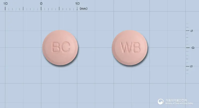 위로바정(수출명:WIROBAR Tablet) 앞뒤 사진 (분홍색 원형, 각인 BC / WB)