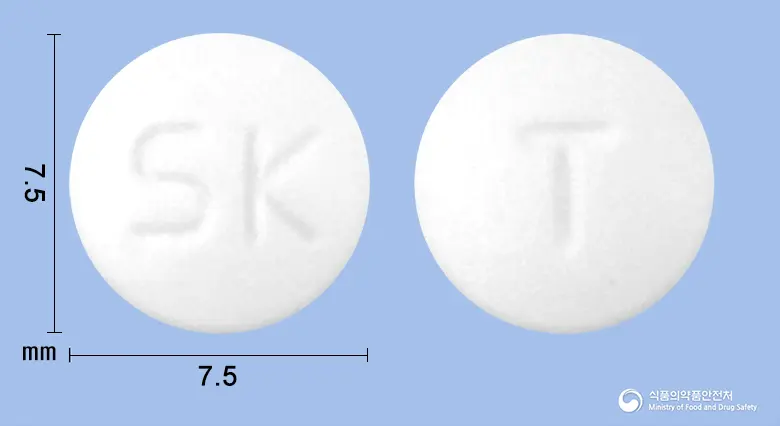 티로메드정(티로프라미드염산염) 앞뒤 사진 (흰색 원형, 각인 SK / T)